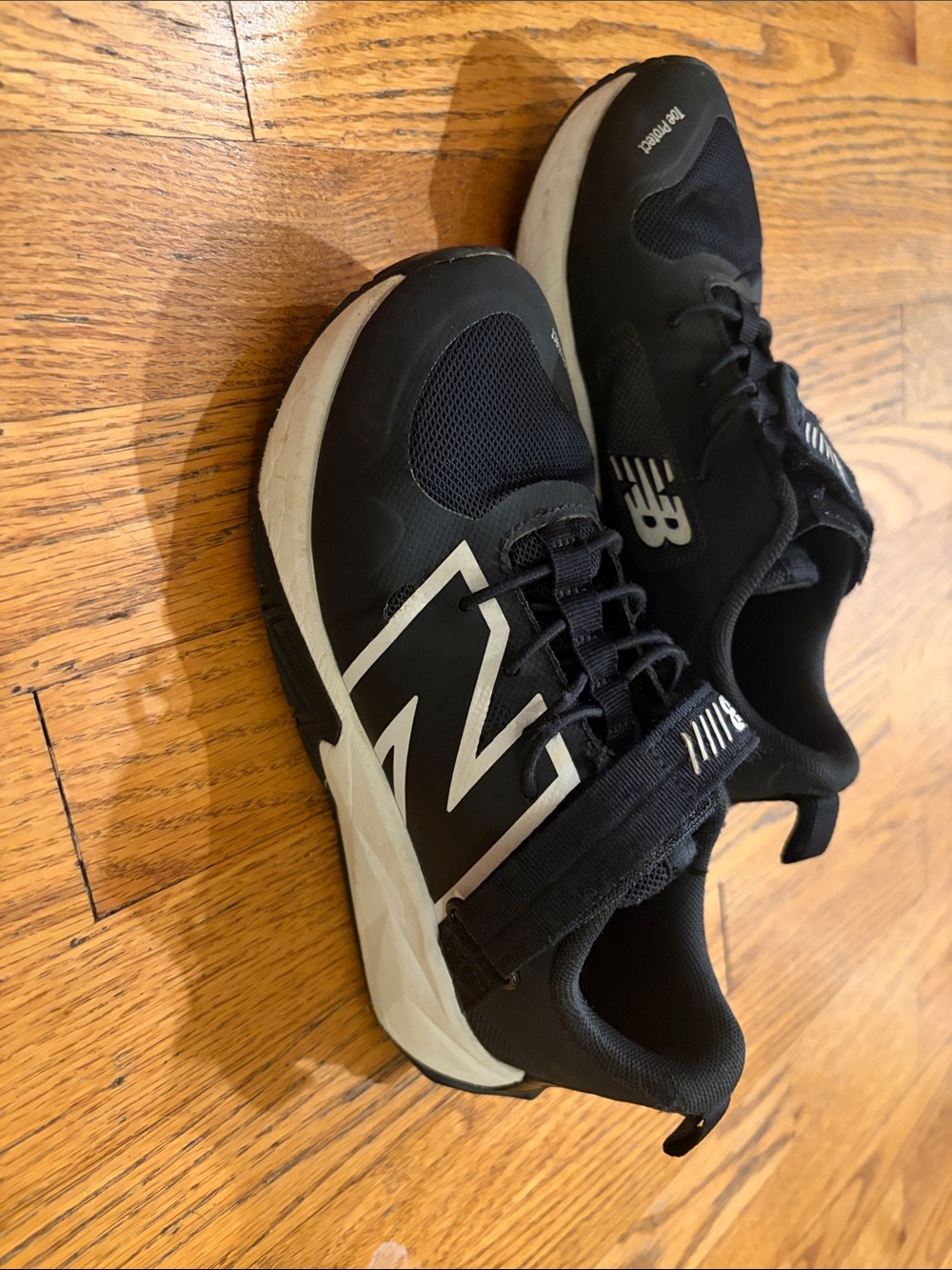 New Balance Boys Black and White Lace-Top Sneakers